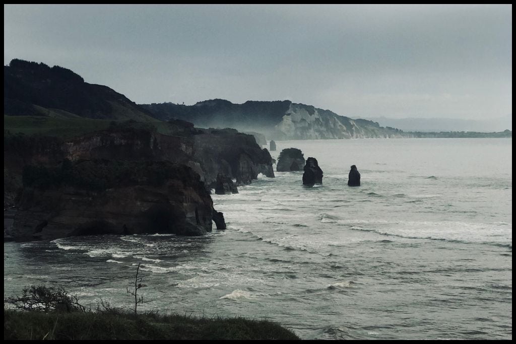 The Three Sisters Rock Formation standing up in the surf at Tongapōrutu Beach.