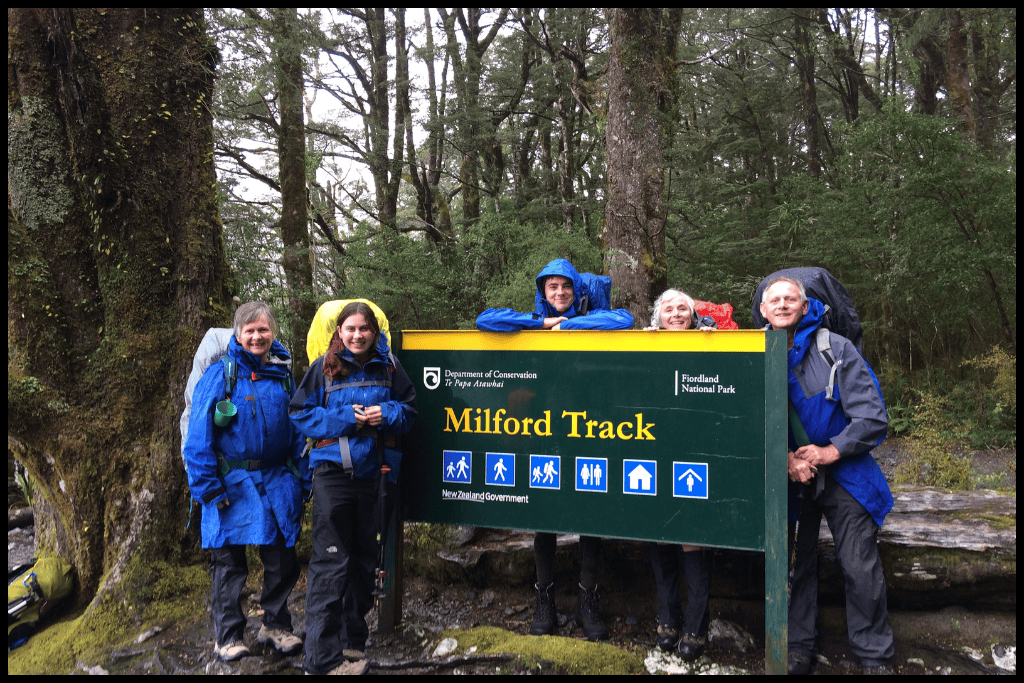 Author and her party of six stand by the Milford Track sign at Glade Wharf, the start of the track.