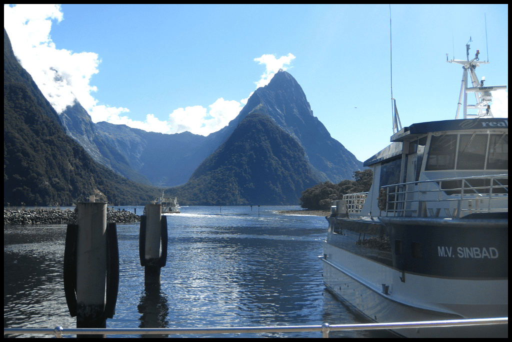 Mitre Peak on a clear day with a shuttle boat in the foreground