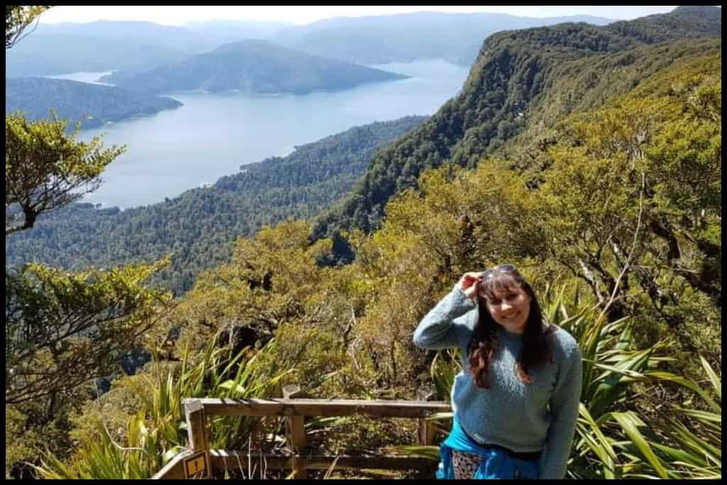 Author pauses at a viewpoint on the way down from Panekire Bluff to smile at the camera.