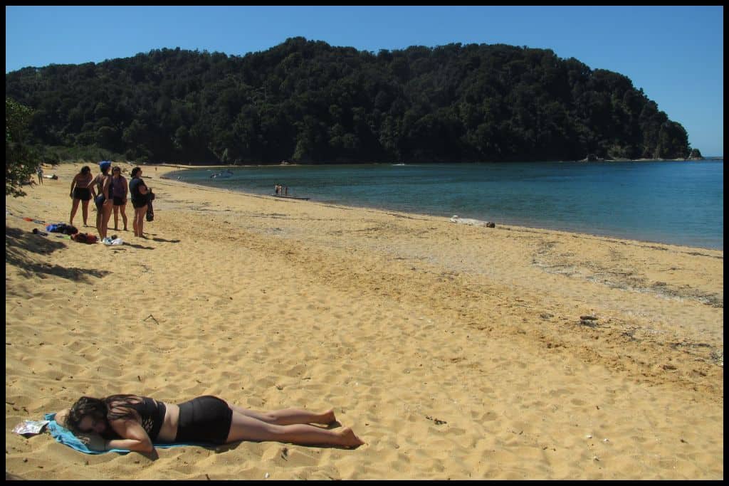 Author lies on Totaranui Beach for a quick spot of sunbathing.