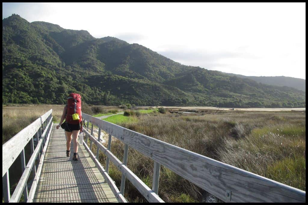 Author retreats over the bridge at the Marahau end of the Abel Tasman Coastal Track.