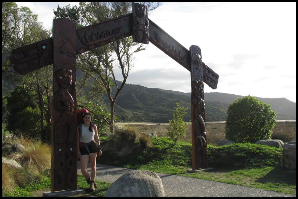 Author stands under the Maori gateway at the Marahau end of the Abel Tasman Coastal Track.