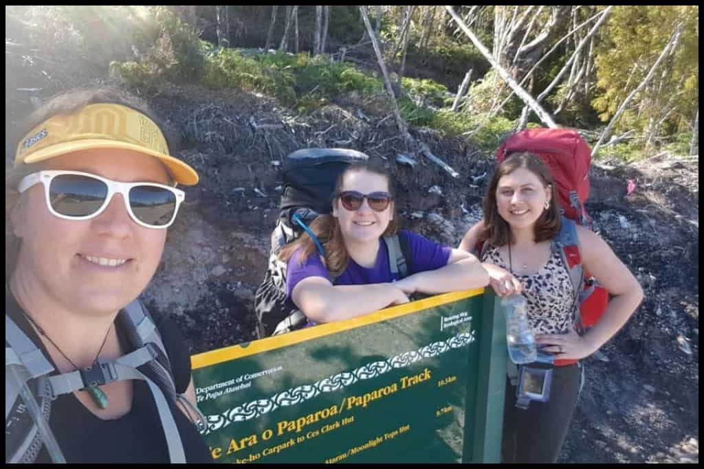 Selfie of the author's party of three hanging out by the Paparoa Track sign at the Smoke-ho Carpark trailhead.