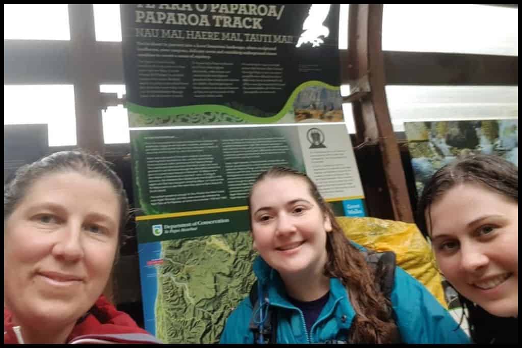 A selfie of the author's party of three at the end of the Paparoa Track, the Punakaiki end, very wet after a rainy day on the trail.