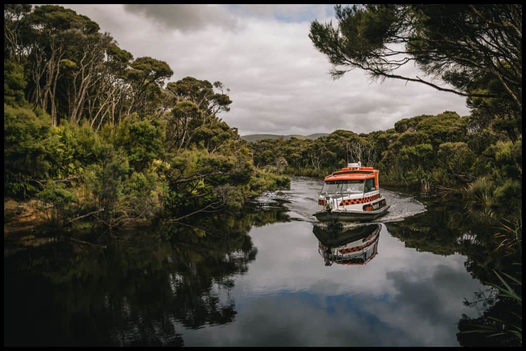 One of the Rakiura Water Taxi boats makes its way out of one of the inlets on Stewart Island.
