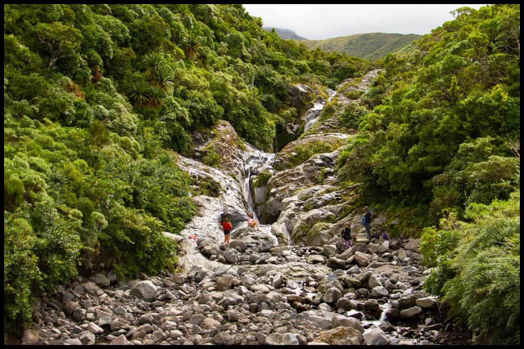 A wide shot shows the boulders under and around Wilkies Pools.