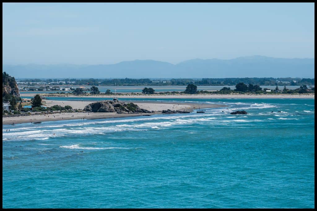 Black sand Sumner Beach, taken from out over the water, looking back at the shore.