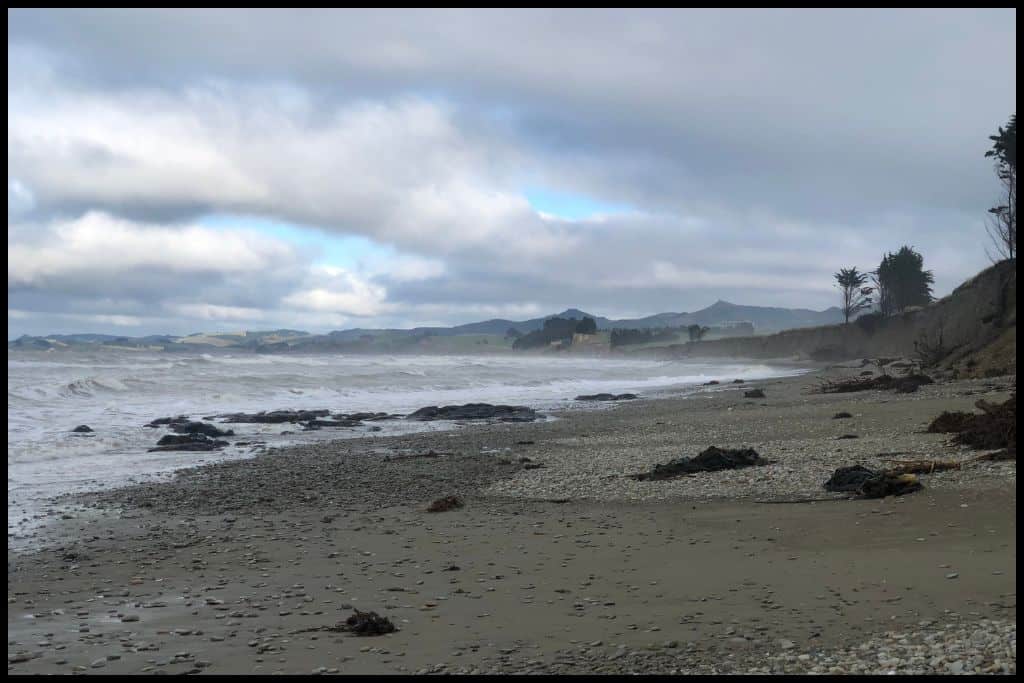 Waves crash onto a desolate beach north of the Moeraki Peninsula.