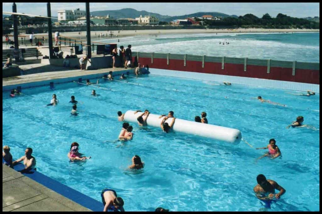 Figures are dotted in the St Clair Saltwater Pool, pictured from above.