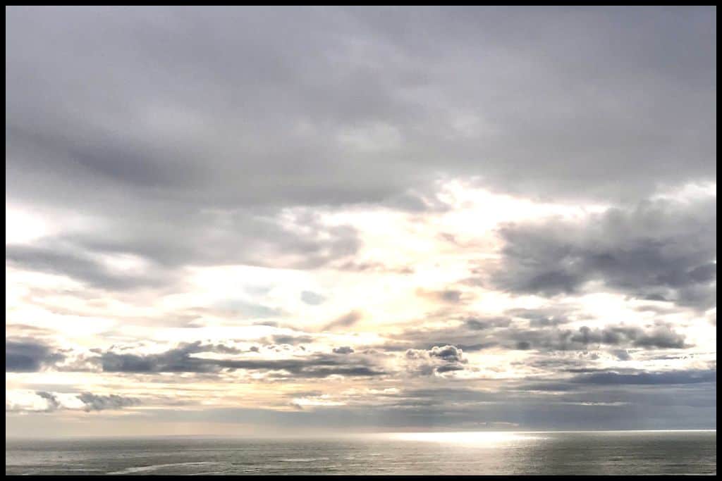 A silvery sunset over the Northern Taranaki coastline.