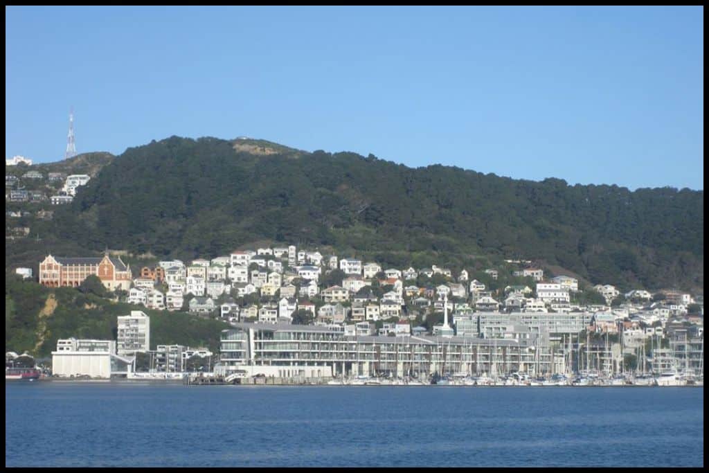 Wellington Harbour with coastal suburbs set into the hills, as seen from the city ferry.