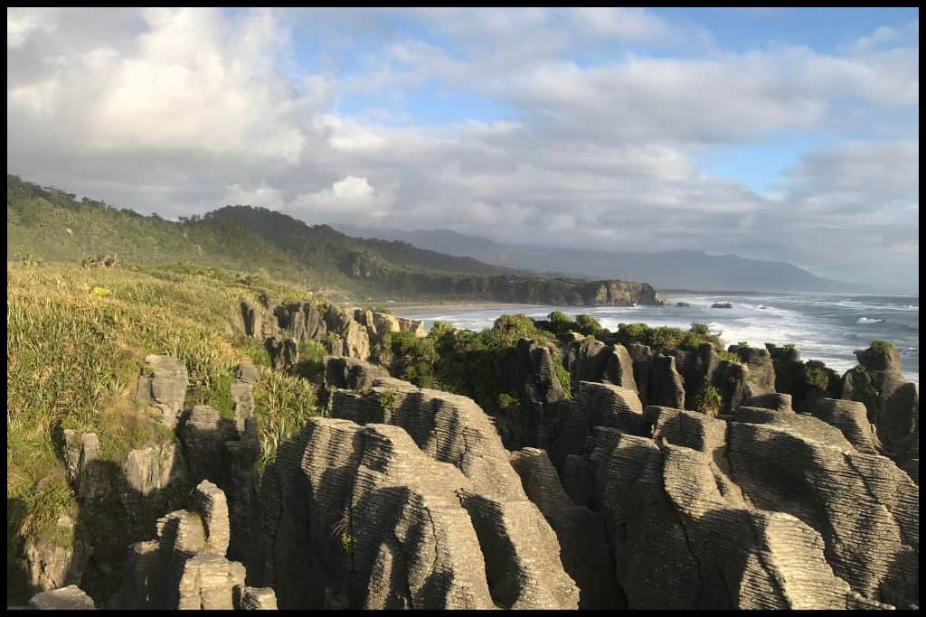 Late afternoon sun shines down on the Punakaiki Pancake Rocks.