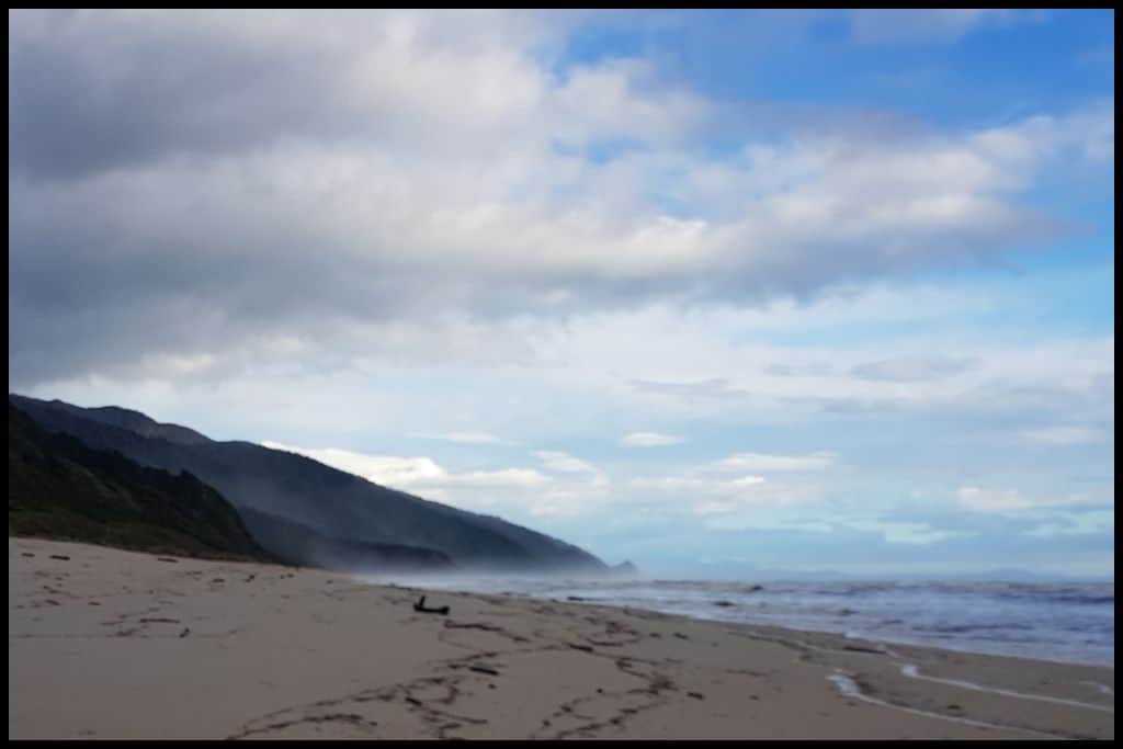 Scotts Beach, with sea spray making the beach hazy.